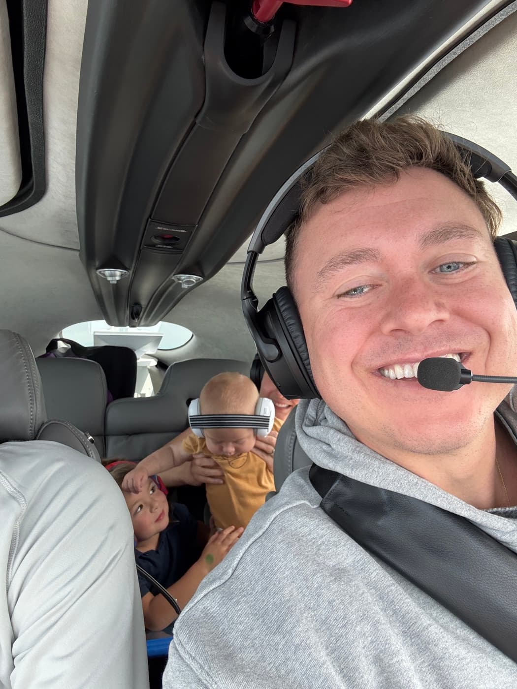 Andy flying with his kids in the back seat